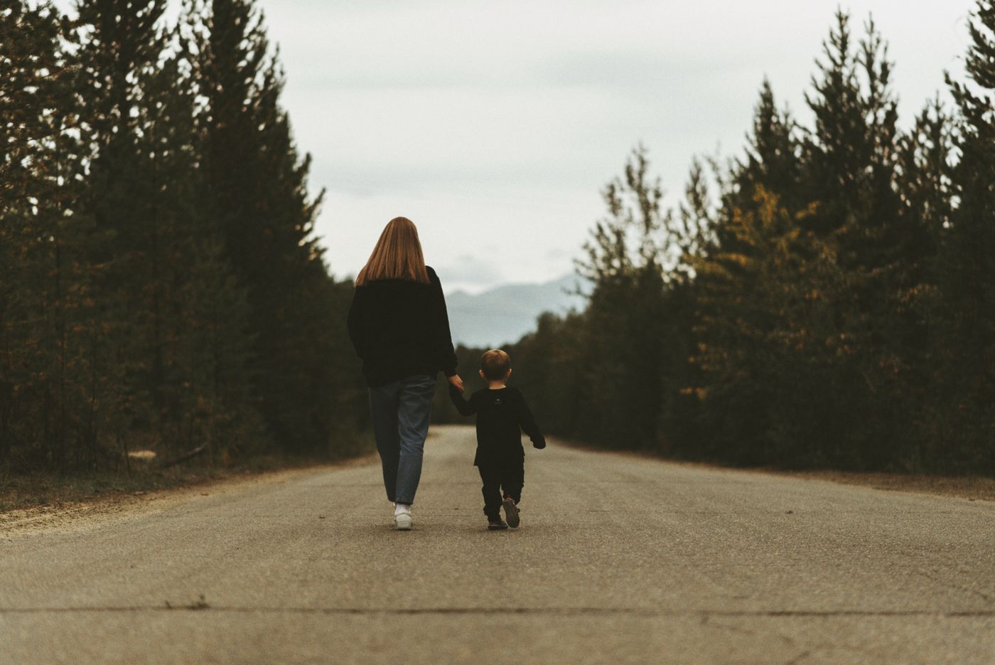 Parent and child walking hand in hand—child custody counsel in eastern North Carolina