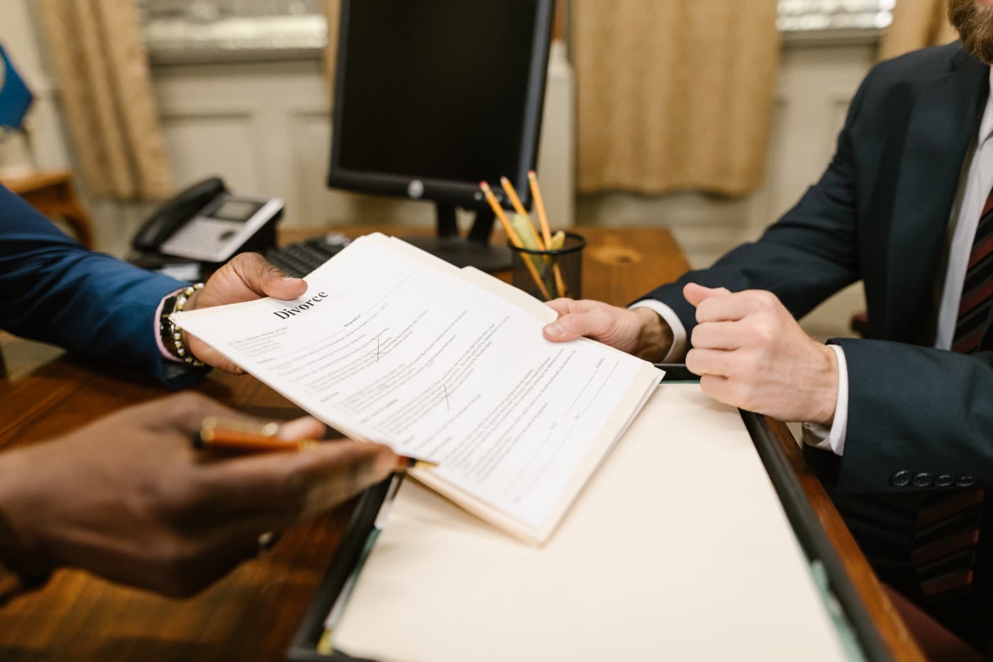 Divorce paperwork review during a legal consultation